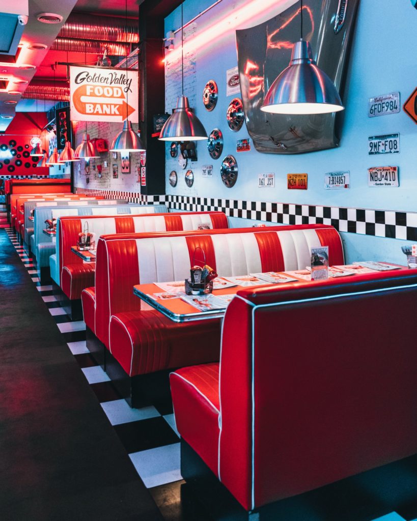 row of red and white booth at old classic diner; restaurant plans