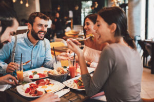 group of friends eating at a restaurant