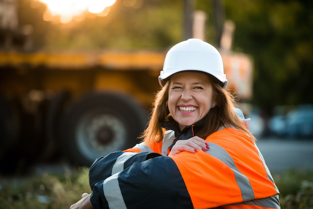 Woman engineer smiling; women in construction week