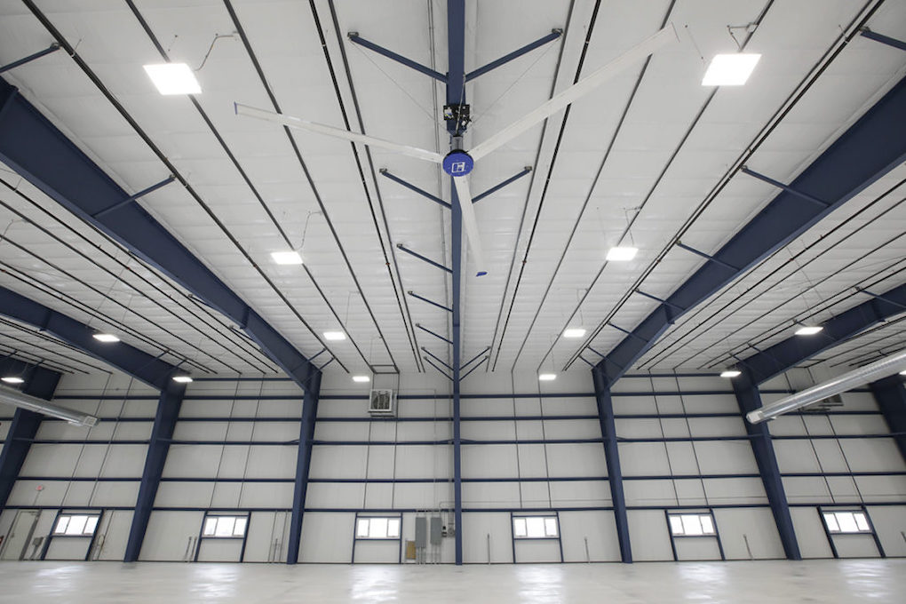 pre-engineered metal building average cost; inside of empty warehouse