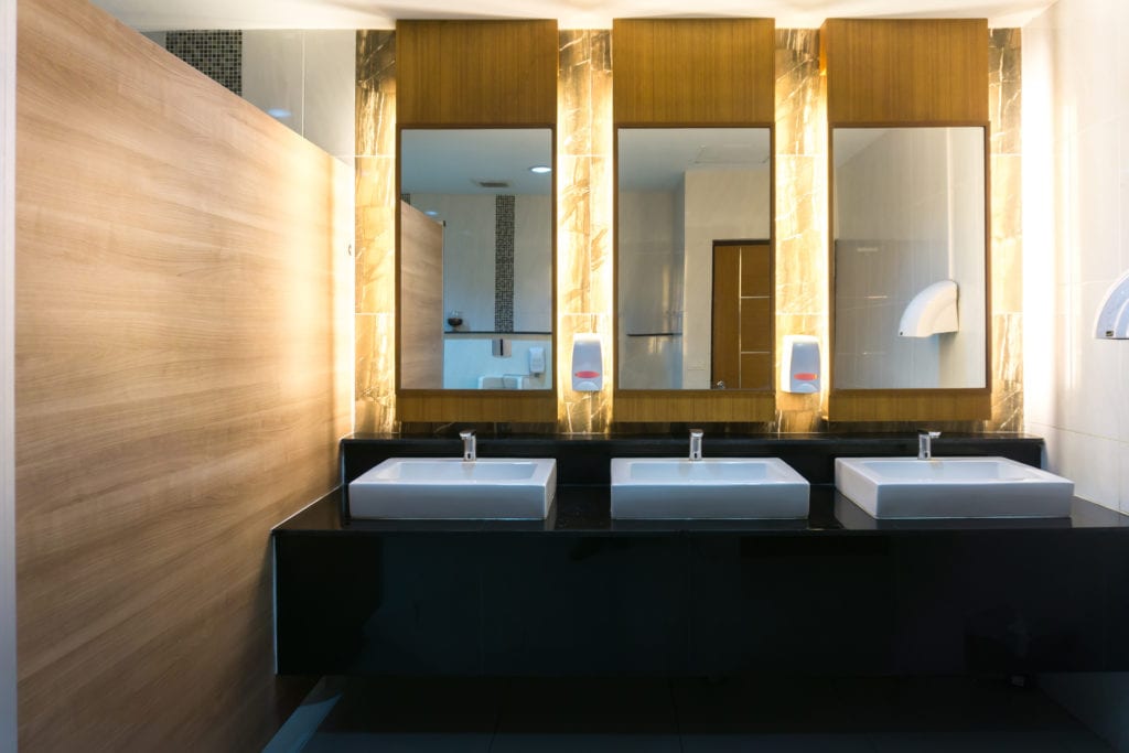 Commercial bathroom remodeling ideas with three sinks and mirrors.
