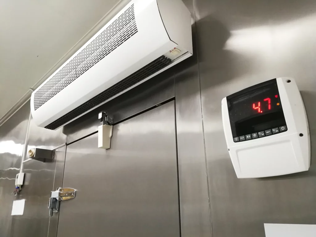 ac unit and screen shows warehouse temperature