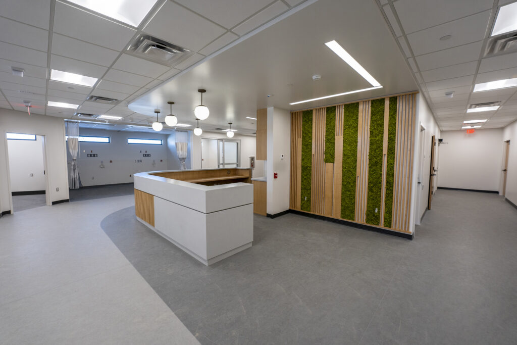 Med surgical suites with contemporary design and green wall accents.